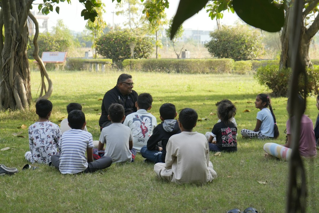 Man telling story to children in park