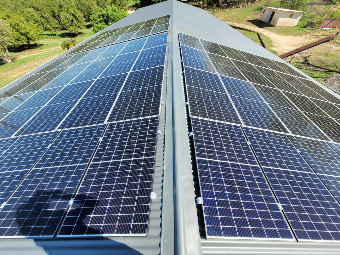 Solar panels installed on a grey corrugated metal roof