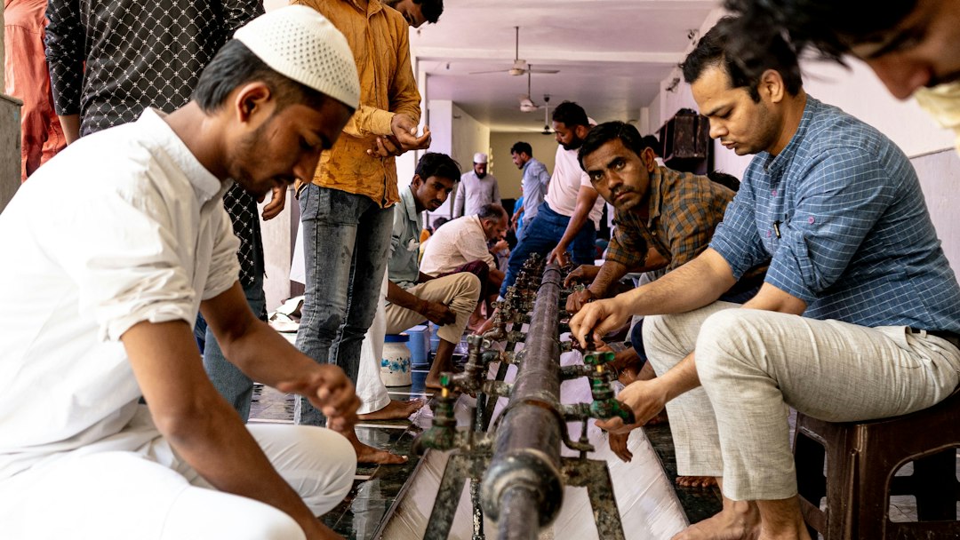 Men working with textile machinery in a workshop